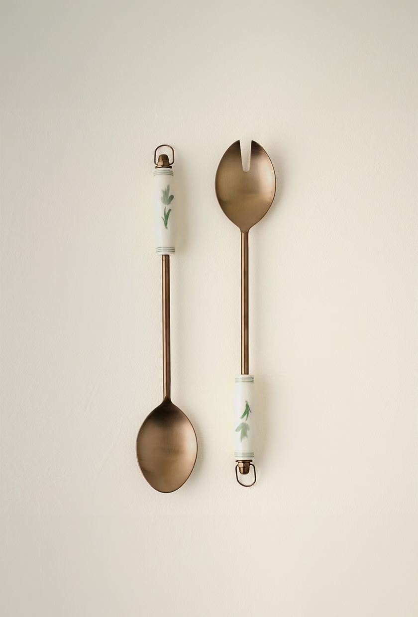 Copper serving utensils with white handles with floral design from Magnolia