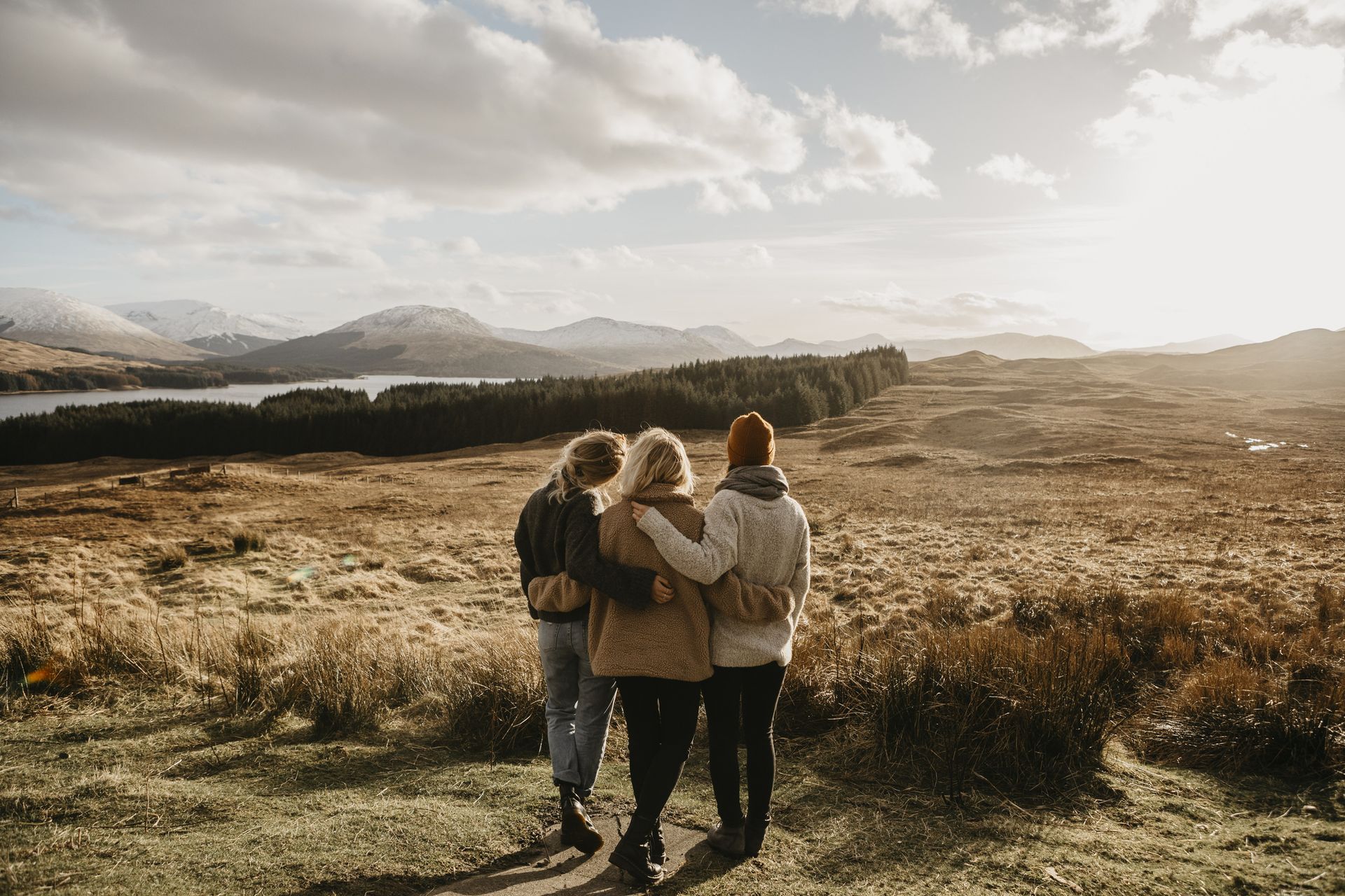 Three female friends looking at view
