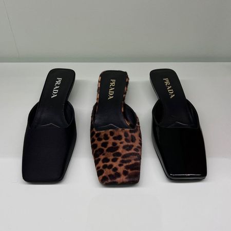 three pairs of Prada square-toe mules in black satin, leopard print, and black patent leather