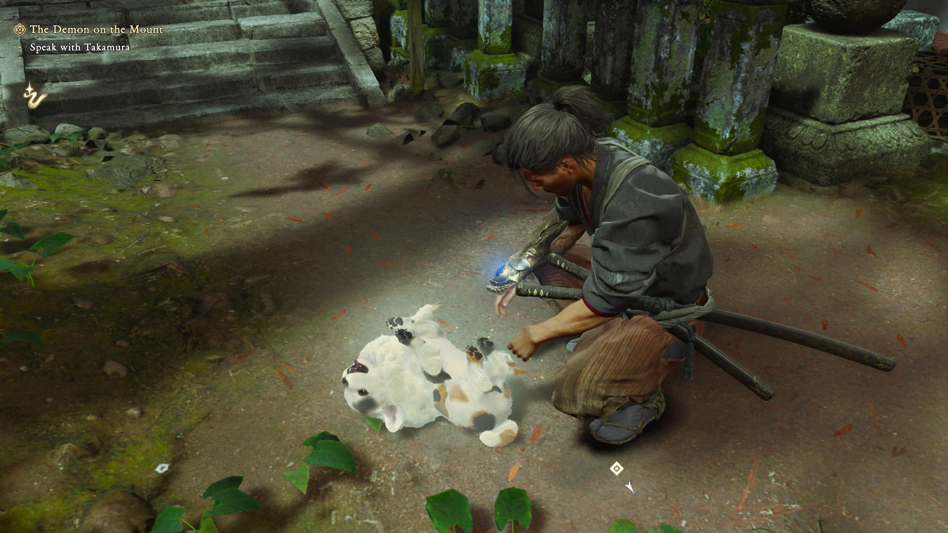 Musashi plays with a cat in a temple in Onimusha: Way of the Sword