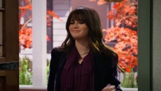 Selena Gomez standing in a door in Wizards Beyond Waverly Place.