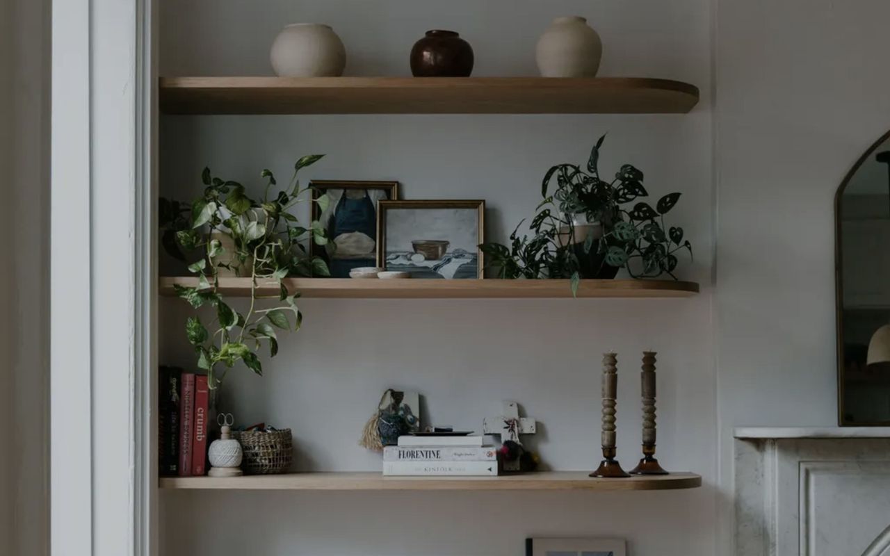 wood floating shelves with rounded edge and styled with books and objects