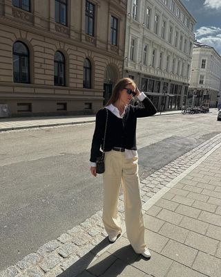 12 Scandi Outfit Ideas: Annabel wears a shirt, jumper and wide-leg trousers.