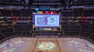 The Pittsburgh Penguins centerhang display shines bright over the ice during a game. 