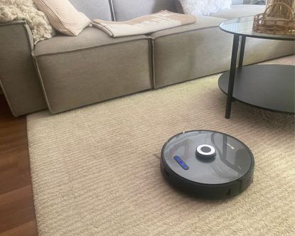 Proscenic M8 Pro robot vacuum mop on rug in Annie's living room