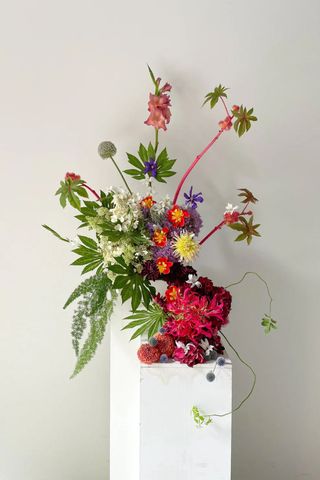 bright flower arrangement on a pedestal