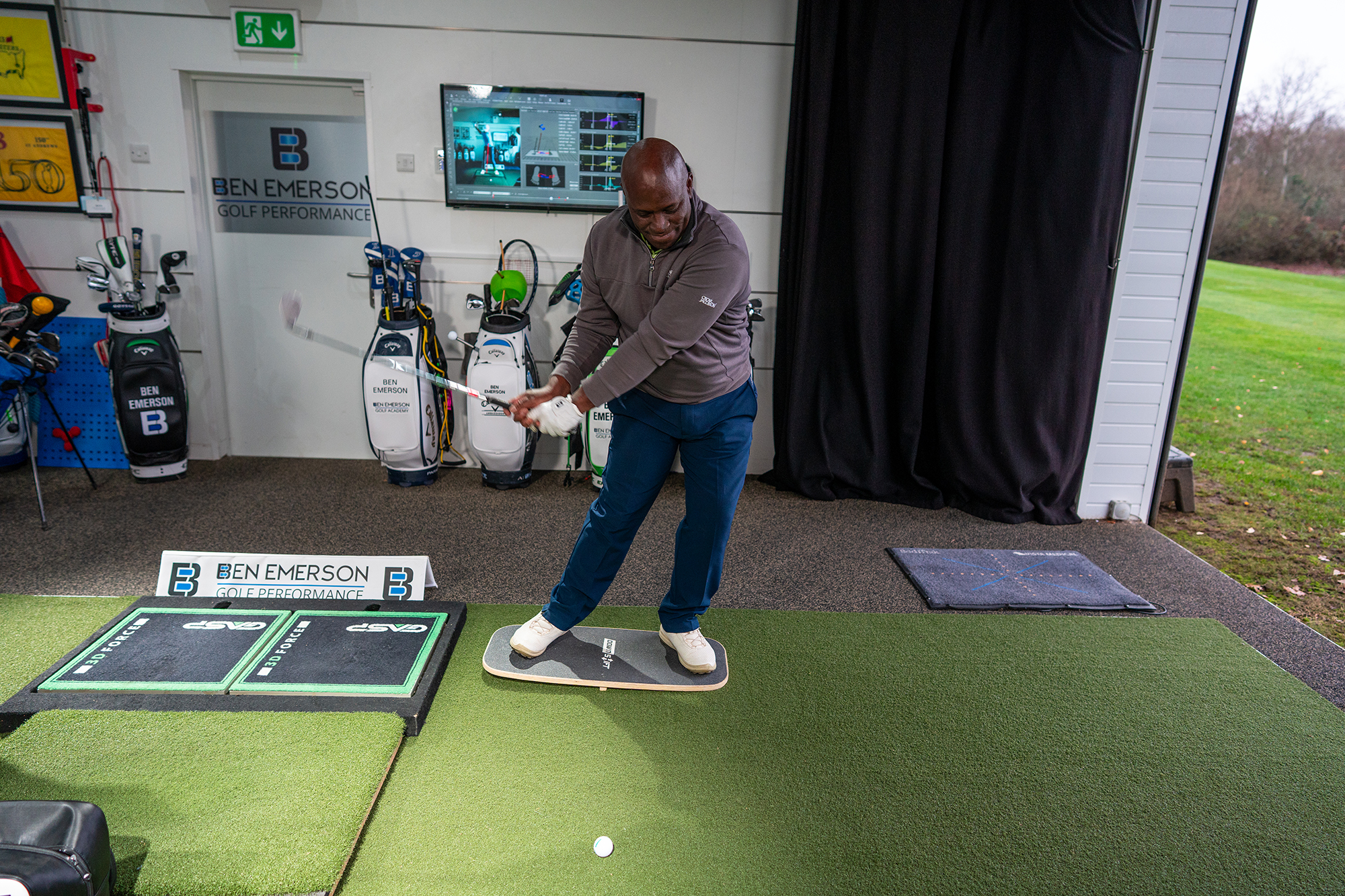 An amateur golfer coming into impact for a short game shot