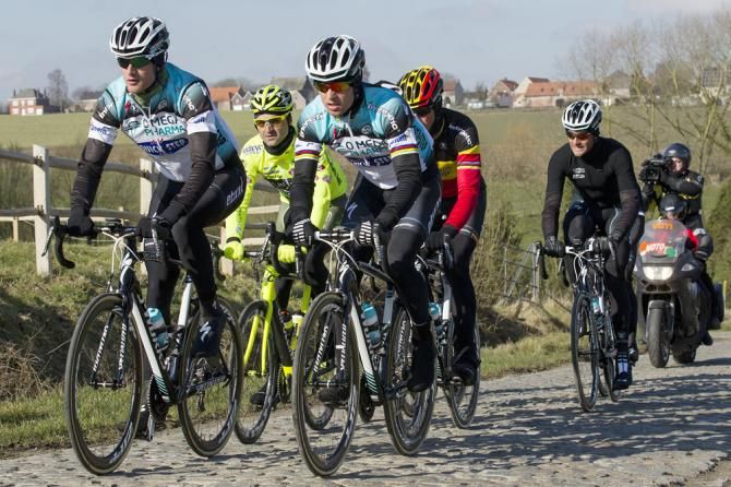 Kevin Hulsmans (Vini Fantini) and members of the Omega Pharma-Quick Step team recon sectors of Saturday's Omloop Het Nieuwsblad course.