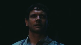 Jack O'Connell's Remmick looking at the music coming from the Juke Joint.