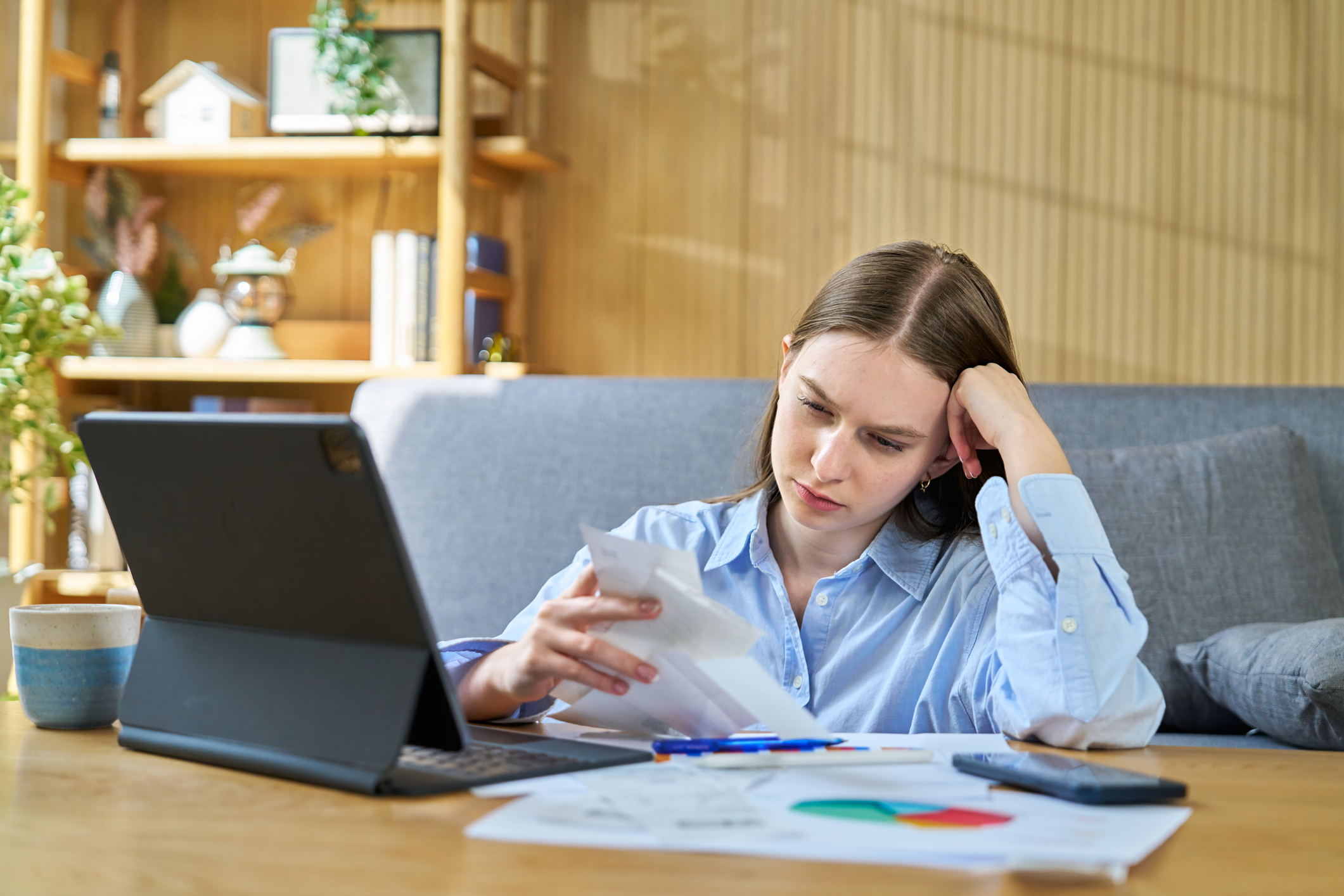 Stressed woman calculating tax bills