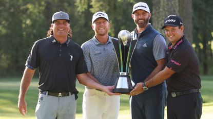 Pat Perez, Talor Gooch, Dustin Johnson and Patrick Reed of 4 Aces GC pose with team championship trophy after the second LIV Golf Invitational Series event in Oregon