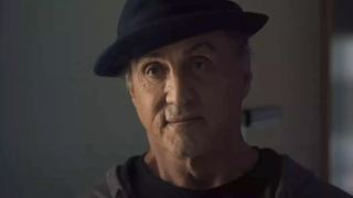 Sylvester Stallone in Creed II wearing a hat.