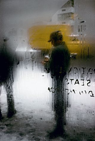 Saul Leiter portrait of a man on a snowy New York day