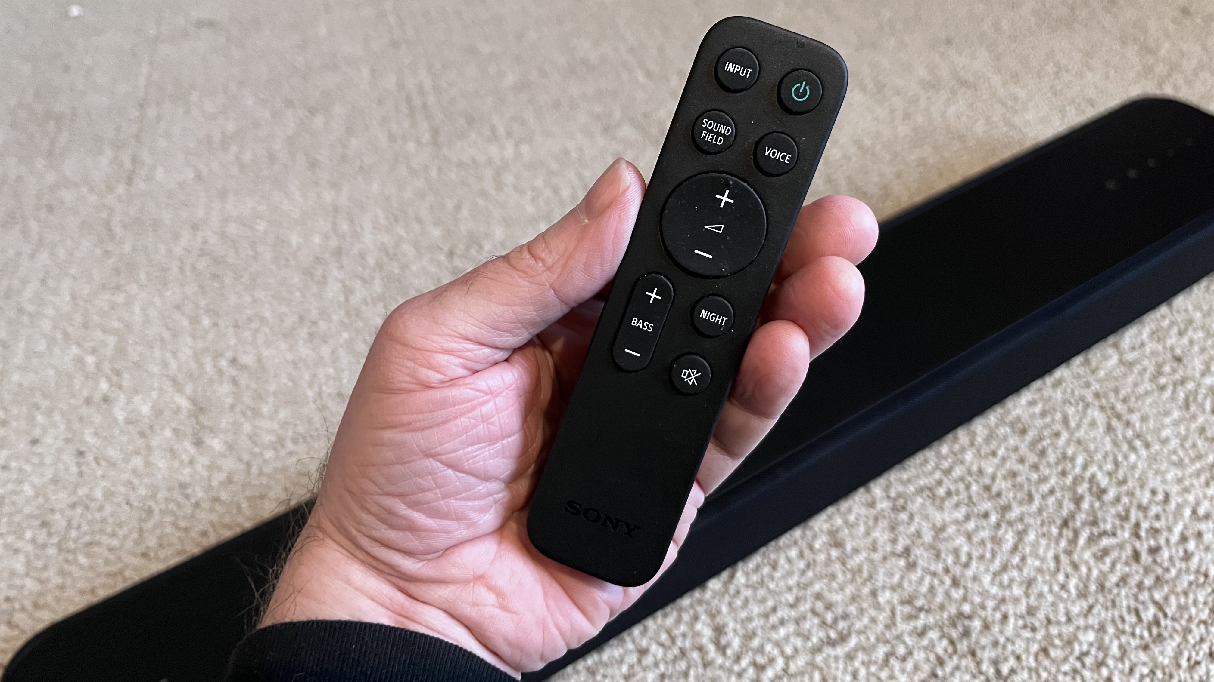 Sony HT-S2000 soundbar remote control held in hand