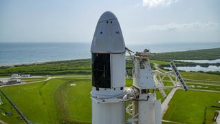 Seen here is an up-close view of the SpaceX Dragon spacecraft atop the company’s Falcon 9 rocket after being raised to a vertical position at NASA’s Kennedy Space Center in Florida on Aug. 25, 2021, in preparation for the 23rd commercial resupply services launch to the International Space Station.