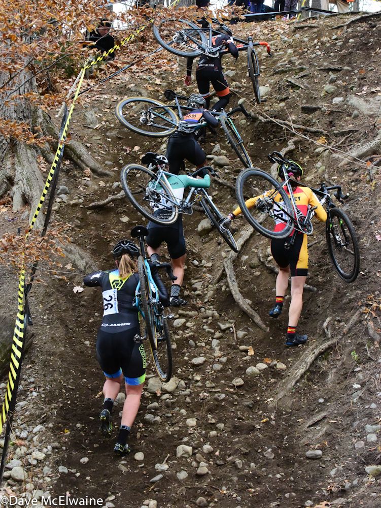 The Elite Women claw their way up the steep run-up on lap two.