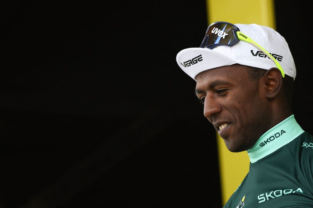 Intermarche - Wanty team's Eritrean rider Biniam Girmay celebrates on the podium with the best sprinter's green jersey after the 8th stage of the 111th edition of the Tour de France cycling race, 183,5 km between Semur-en-Auxois and Colombey-les-deux-Eglises, on July 6, 2024. (Photo by Anne-Christine POUJOULAT / AFP)