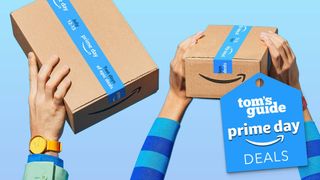 Hands hold Amazon packages bearing Prime Day tape