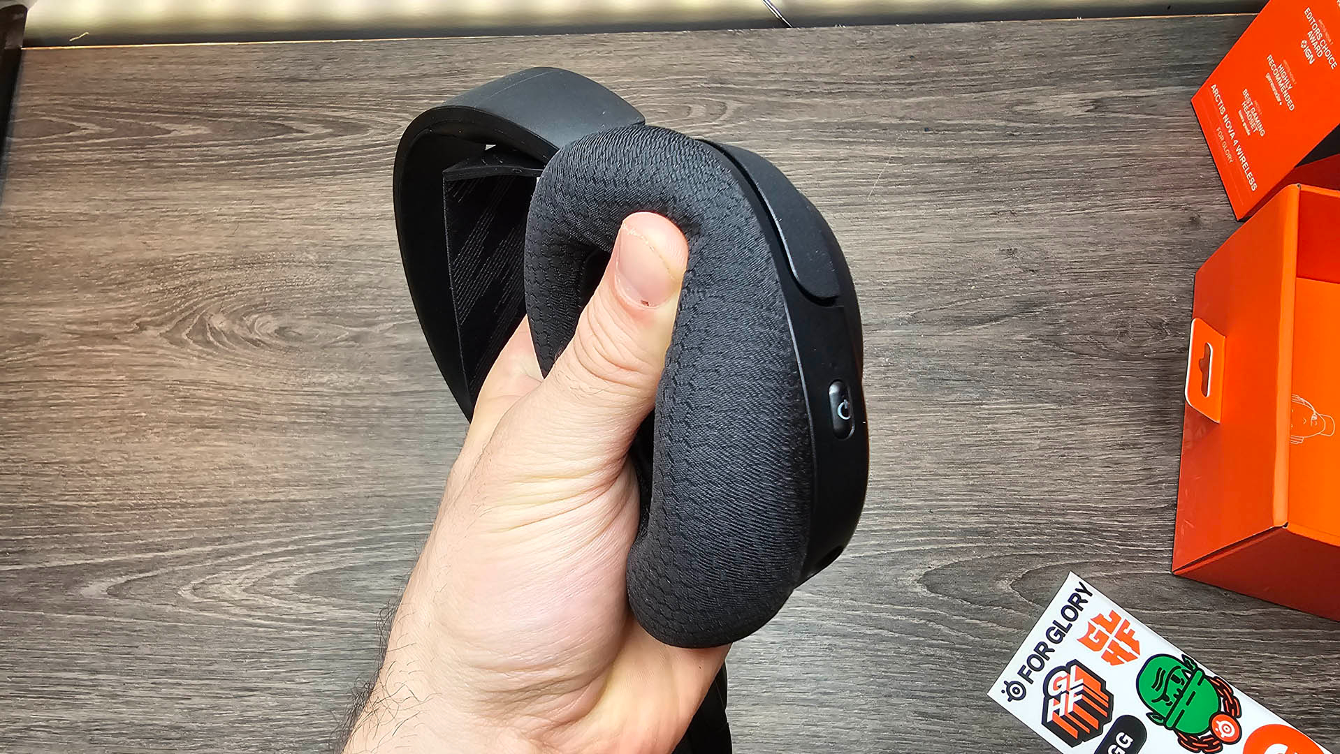 The SteelSeries Arctis Nova 4 Wireless headset in the hands.