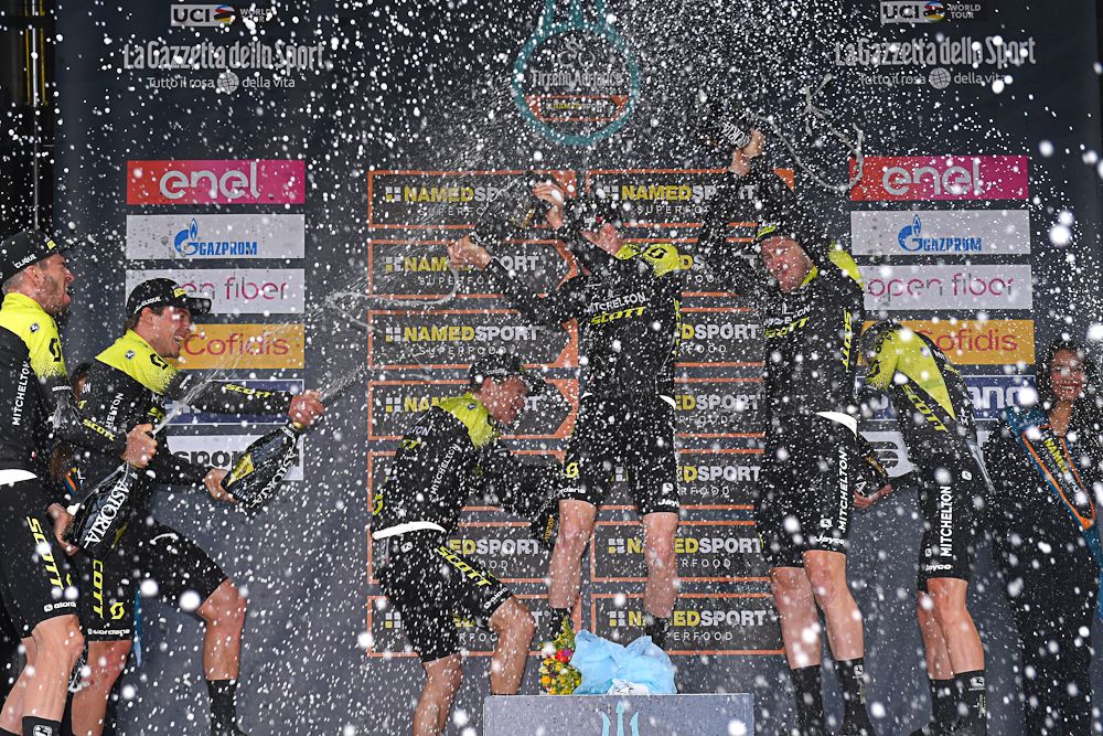 Mitchelton-Scott riders celebrate the team time trial win on the Tirreno-Adriatico podium