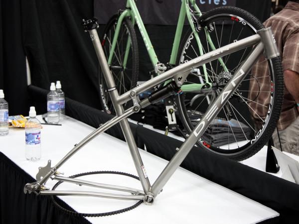 This Dean full-suspension titanium frame features sliding rear dropouts, a 44mm head tube (for straight or tapered steerers), and flex built into the chain stays in lieu of conventional pivots.