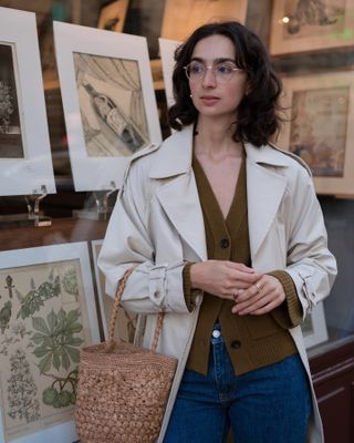 Woman wearing a buttoned-up brown cardigan.