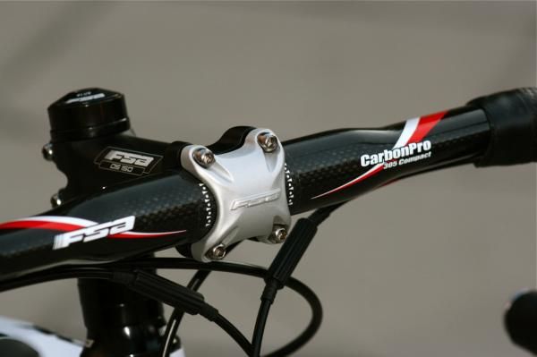 FSA carbon bars, just the right amount of reach, feel and drop for long mileage.