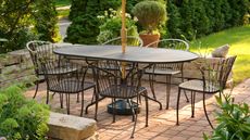 Outdoor dining table and umbrella on patio