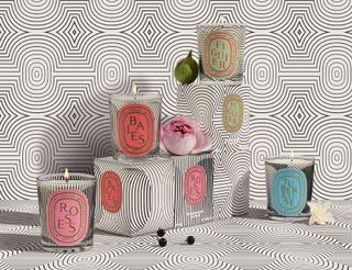 Diptyque 60th anniversary candles in roses, baies, tubereuse and figiur with balck and white graphic designs