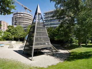 Schlotterbeck under construction, as seen from the nearby park in a densely built part of Zurich