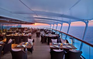 alfresco dining on cruise ship at sunset