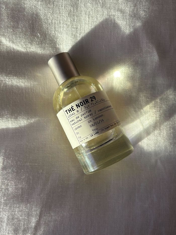Le Labo The Noir 29 on a white linen background