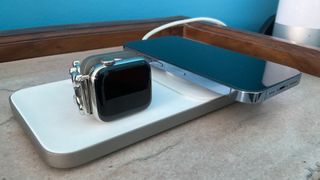 NOMAD Base One Max MagSafe with an Apple Watch and an iPhone on a nightstand