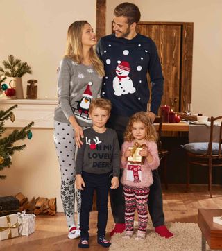 Family wearing Lidl Christmas Jumpers