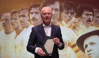 Former German football player Franz Beckenbauer holds his trophy as he attends the opening gala for the Hall of Fame of German Football at the German Football Museum in Dortmund on April 1, 2019. (Photo by Ina Fassbender / POOL / AFP) (Photo credit should read INA FASSBENDER/AFP via Getty Images)