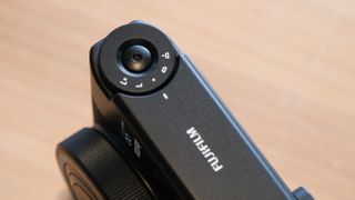 Fujifilm Instax Mini 99 instant camera top dials close up