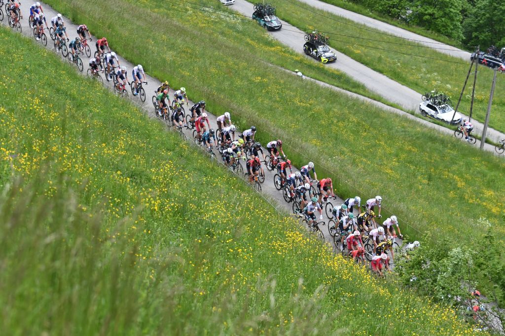 TOPSHOT The pack rides during the seventh stage of the 73rd edition of the Criterium du Dauphine cycling race a 171km between SaintMartinLeVinoux and La Plagne on June 5 2021 Photo by Alain JOCARD AFP Photo by ALAIN JOCARDAFP via Getty Images
