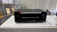 A Denon AVR-X2900H home cinema amplifier on a white table