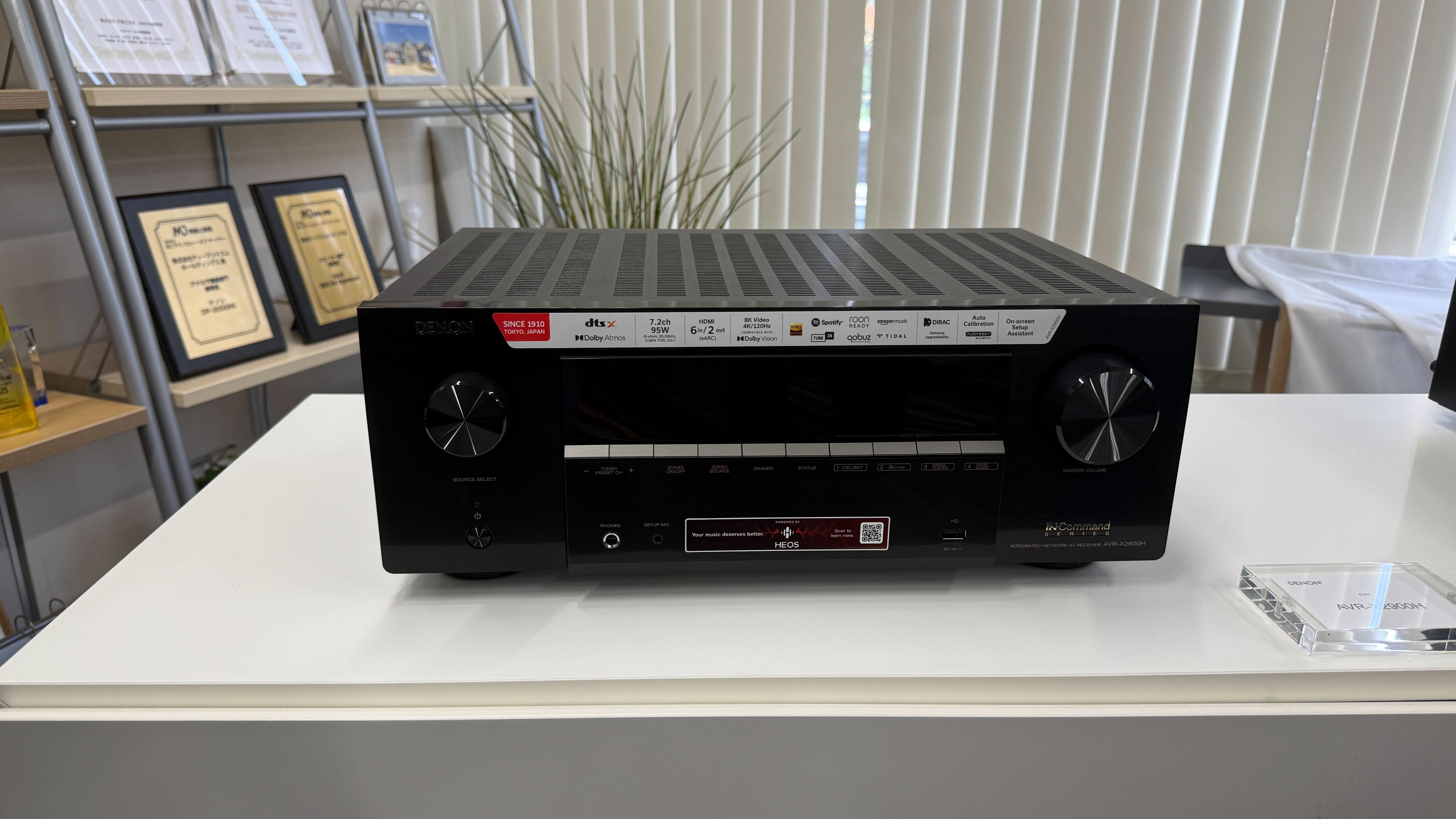A Denon AVR-X2900H home cinema amplifier on a white table