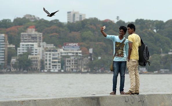 Students take a selfie in Mumbai. 