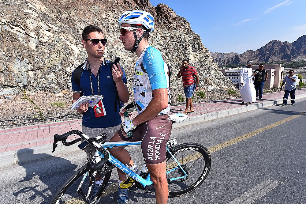 Alexis Gougeard speaks with a journalist after stage 1 in Oman.