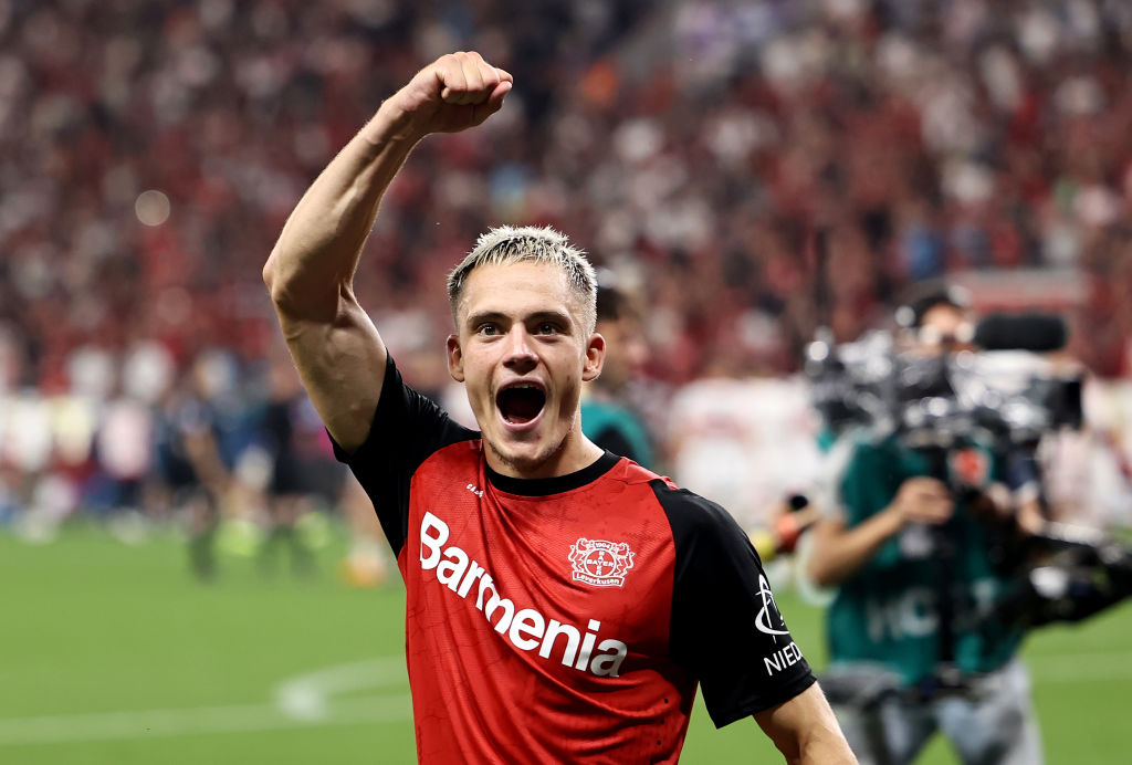 Liverpool bound Florian Wirtz of Bayer 04 Leverkusen celebrates following the team's victory in the penalty shoot out during the DFL Supercup 2024 match between Bayer 04 Leverkusen and VfB Stuttgart on August 17, 2024 in Leverkusen, Germany.