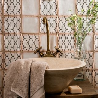 rustic tile wall wash basin and towel