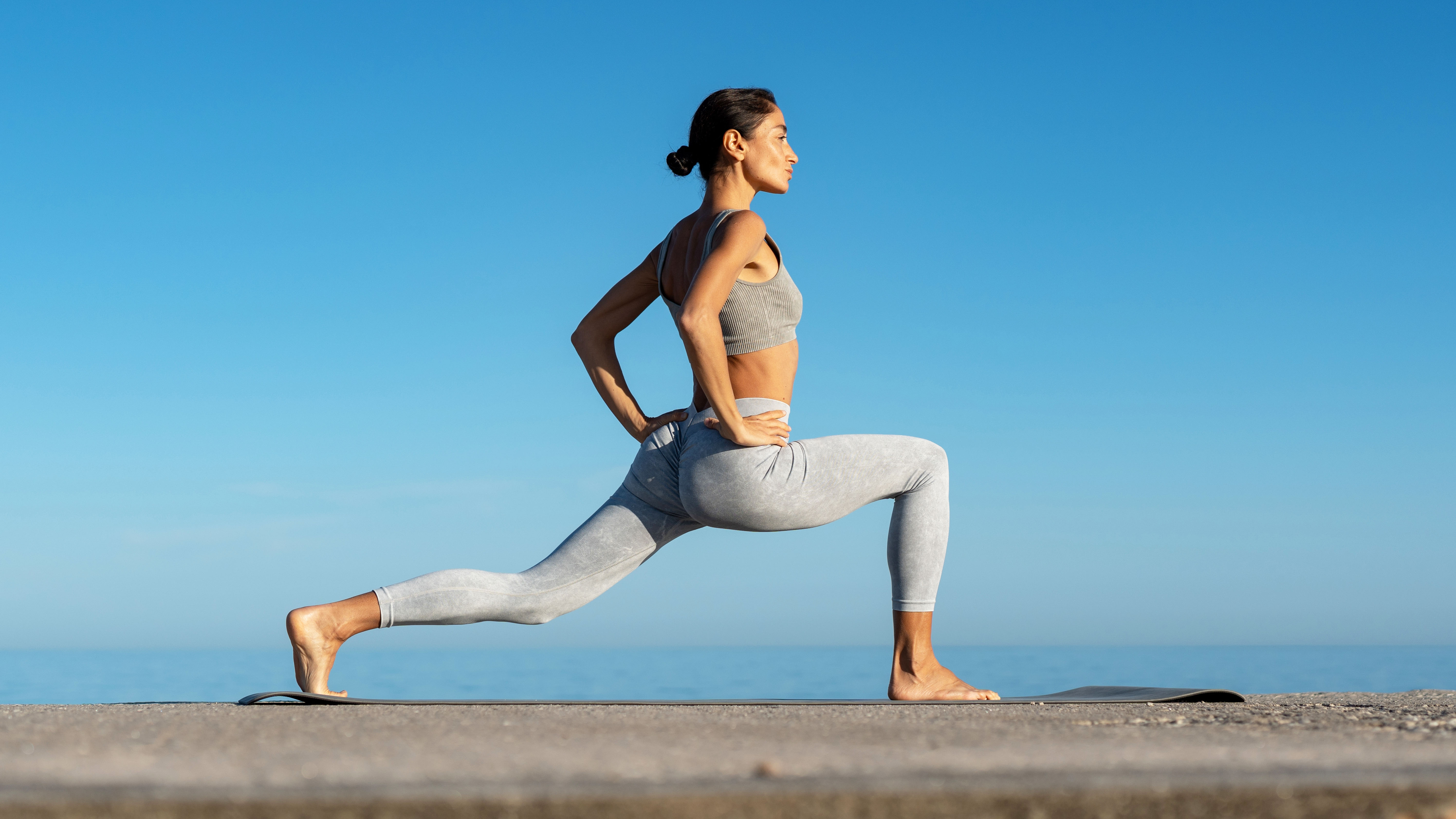 a photo of a woman doing a lunge