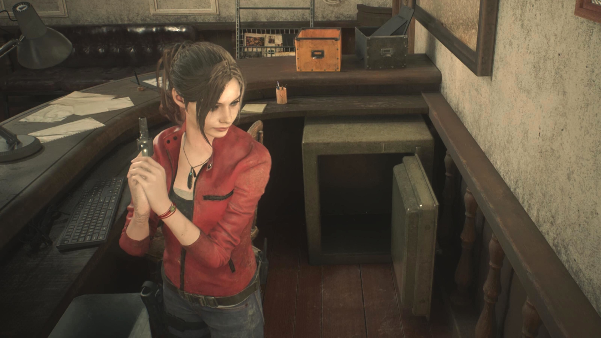 Resident Evil 2 Remake - Claire standing in front of an open safe