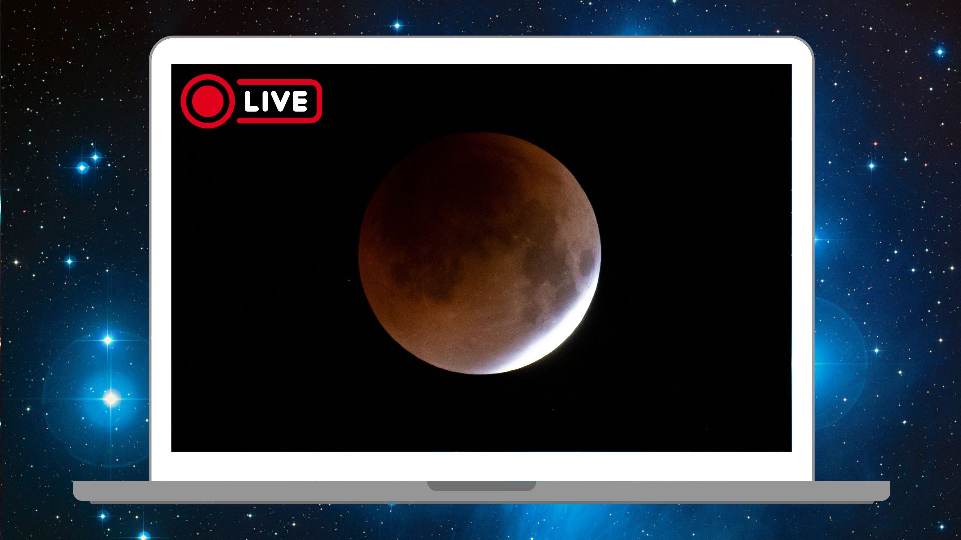 A white laptop is pictured against a starry deep space background. On its screen is an eclipsed full moon in a black sky.