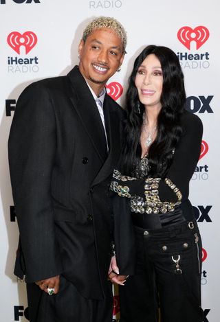 Alexander Edwards and Cher pose in the press room during the 2024 iHeartRadio Music Awards at Dolby Theatre on April 01, 2024 in Hollywood, California.