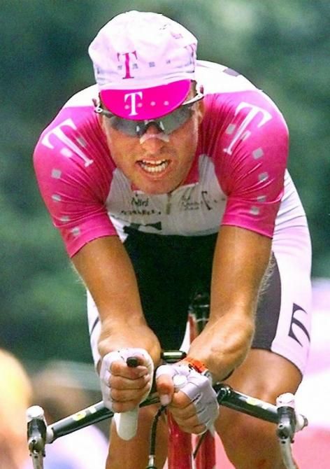 Bjarne Riis was aware of the value of aero bars back in 1997 but even so, a traditional cap still won out over an aerodynamic helmet.
