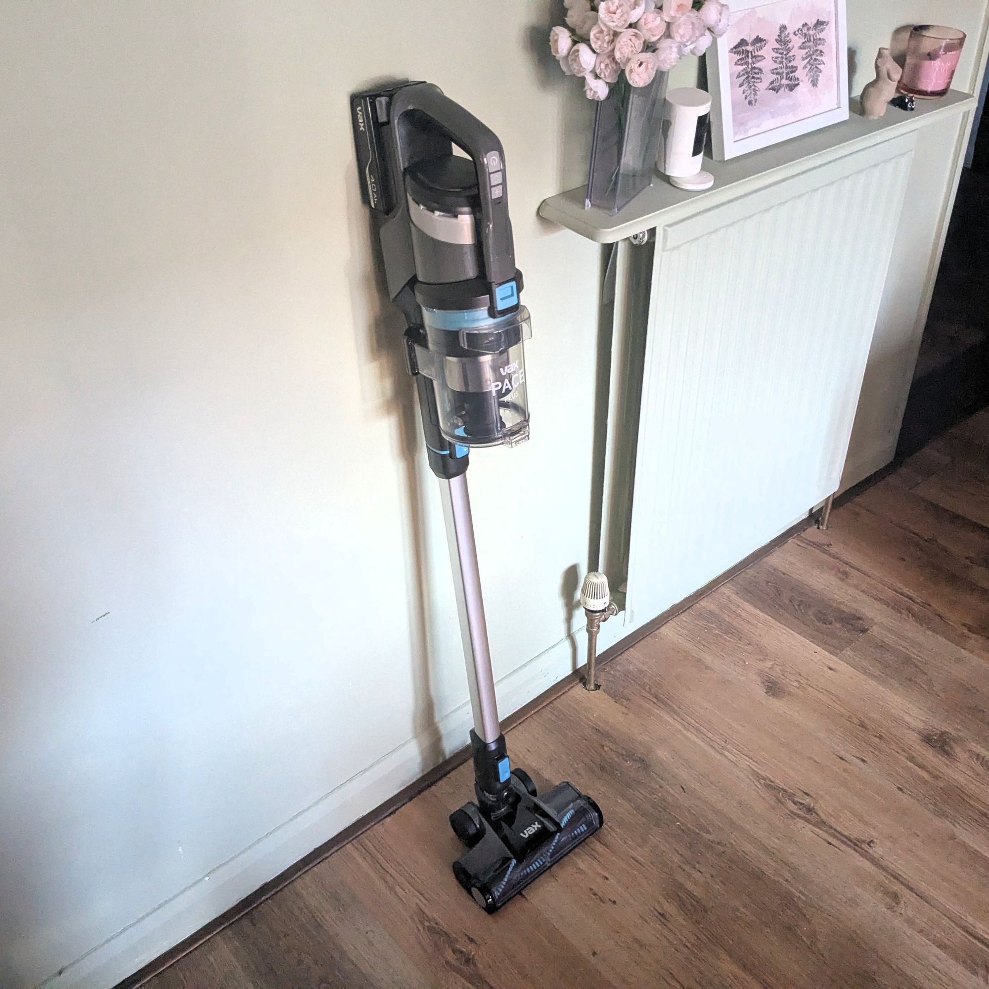 VAX Pace Plus Cordless Vacuum Cleaner leaning against white painted wall