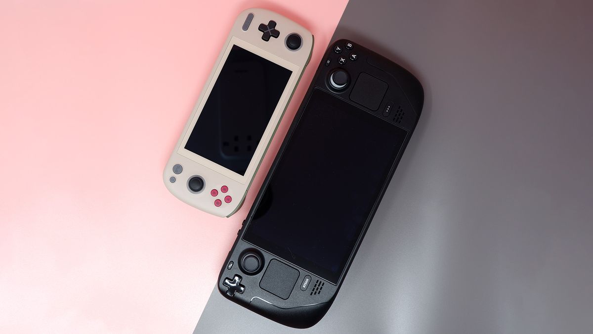 Ayaneo Air 1S handheld gaming PC on a pink background.